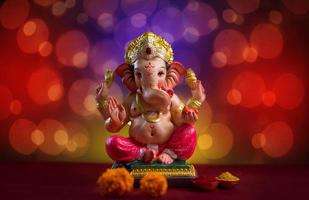 Hindu God Ganesha on Blured bokeh background, Ganesha Idol. photo