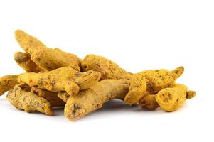 Dry Turmeric roots or barks isolated on white background photo