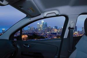 Car window with view of Philadelphia skyline at night, USA photo