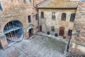 The medieval architecture of San Gimignano, iconic town in Italy photo