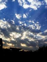 White and grey fluffy clouds in the blue sky with morning light photo