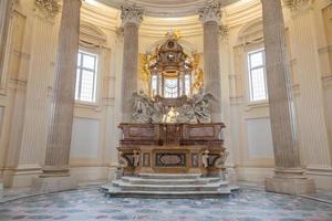 Baroque catholic church altar in Italy. Old interior religious building. photo