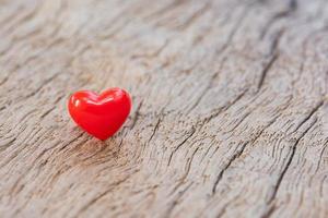 Valentines Day background with red hearts on plank wooden, copy space photo