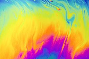 Psychedelic multicolor patterns background. Photo macro shot of soap bubbles