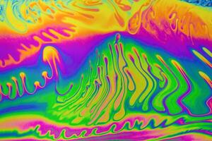 Psychedelic multicolor patterns background. Photo macro shot of soap bubbles