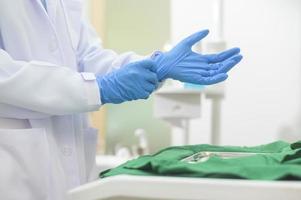 Female dentist wearing medical gloves Prepare to work in a dental clinic, dental concepts and healthcare. photo