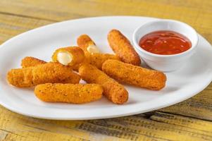 Mozzarella sticks with chili sauce photo