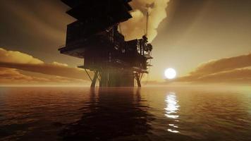 Offshore oil rig platform in sunset or sunrise time video