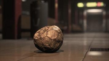 old soccer ball in empty subway video