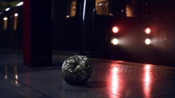 old soccer ball in empty subway video