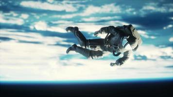 Astronaut floating above the Earth Elements of this image furnished by NASA video