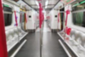 Blurred people on subway. inside train station. Defocused image photo