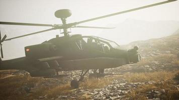 military helicopter in mountains at war photo