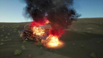 burned tank in the desert at sunset photo