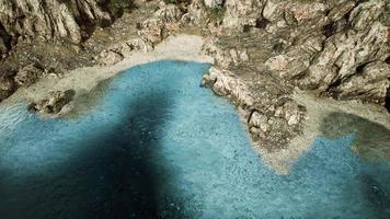 aerial view from flying drone of rocky island in Atlantic ocean photo