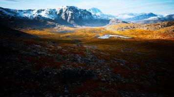 mountains with snow and dry hills in Chile photo