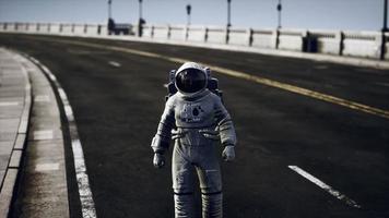 astronaut in space suit on the road bridge photo