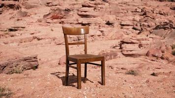 old wooden chair on rocks of Grand Canyon photo