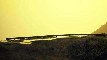 atlantic ocean road near the mountain photo