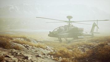 military helicopter in mountains at war photo