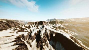 Rocks covered in snow in ski resort photo