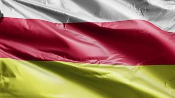 North Ossetia flag slow waving on the wind loop. North Ossetia banner smoothly swaying on the breeze. Full filling background. 20 seconds loop. video