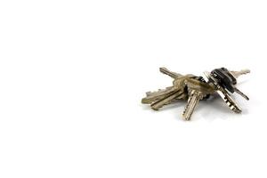 Large bunch of keys isolate on white background photo