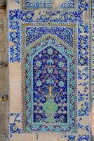 asian old ceramic mosaic. elements of oriental ornament on ceramic tiles photo