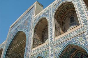 Arch and architecture of the ancient Registan in Samarkand. Ancient architecture of Central Asia photo