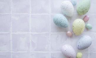 Colorful Easter eggs on tile background photo