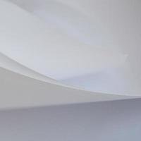 abstract background of a twisted sheet of white paper photo