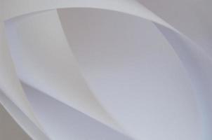 abstract background of a twisted sheet of white paper photo