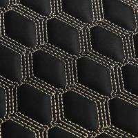 Texture of black leather background with square pattern and stitch, macro photo