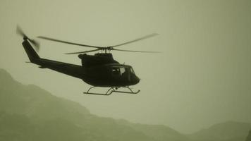 Slow Motion United States military helicopter in Vietnam photo