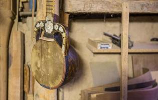 equipment in the workshop for the restoration of ancient musical instruments photo
