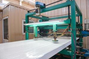 Press machine glutes panel. Plant for the production of sandwich panels from styrofoam photo