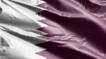 Quatar textile flag slow waving on the wind loop. Qatari banner smoothly swaying on the breeze. Fabric textile tissue. Full filling background. 20 seconds loop. video