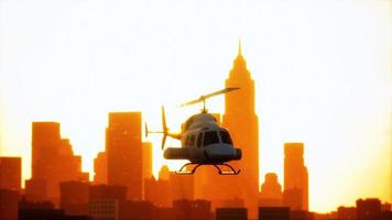 Silhouette helicopter at city scape background photo