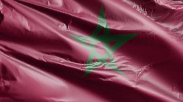 bandeira de Marrocos acenando lentamente no loop de vento. bandeira marroquina balançando suavemente na brisa. fundo de preenchimento completo. Ciclo de 20 segundos. video
