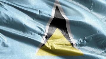 saint lucia textilflagga vajar på vindslingan. saint lucia banner vajande på vinden. tyg textilvävnad. full fyllning bakgrund. 10 sekunders loop. video