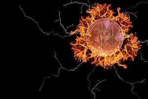 burning red hot valueable bitcoin from crypto currency with many lightnings on black photo