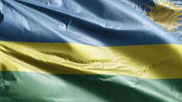 Rwanda textile flag slow waving on the wind loop. Rwandan banner smoothly swaying on the breeze. Fabric textile tissue. Full filling background. 20 seconds loop. video