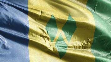 Saint Vincent and the Grenadines textile flag waving on the wind loop. Saint Vincent and the Grenadines banner swaying on the breeze. Fabric textile tissue. Full filling background. 10 seconds loop. video