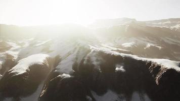 snowy mountains with deep ravine and rock cliffs video