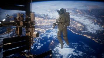 International Space Station and astronaut in outer space over the planet Earth video