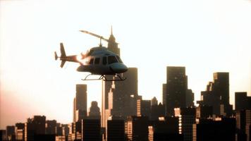 Silhouette helicopter at city scape background photo