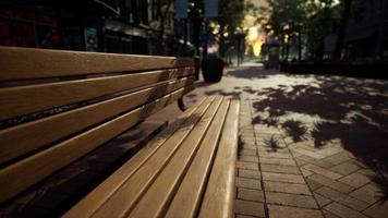 Park bench in downtown on a cloudy afternoon photo