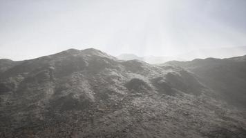 Sun Rays against the Backdrop of the Mountains photo