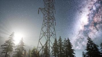 High-voltage power lines on the background of the starry sky photo