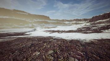 rocks and hills under the snow photo